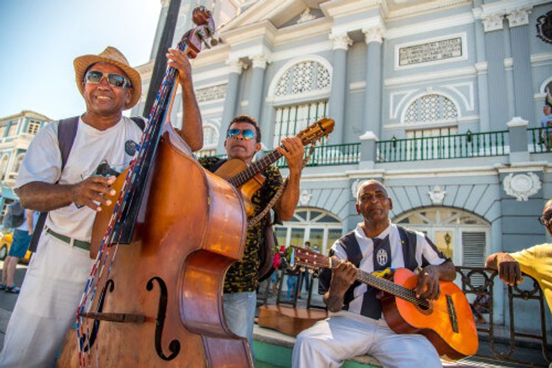 Men play instruments in Trinidad, Cuba.