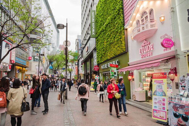 People walk through the Myeongdong commercial area in Seoul, South Korea.