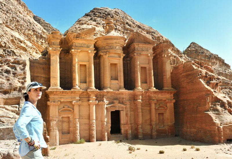 Woman outside the Ad Deir,  the Monastery Temple in Petra, Jordan.