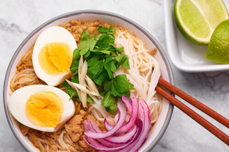 Mohinga is a Burmese fish soup with catfish, rice noodles, chicken eggs and lime.