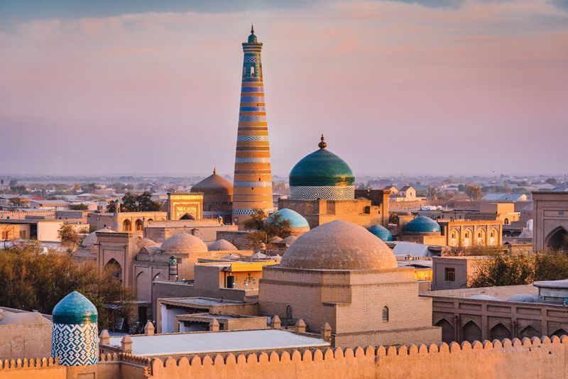 The Xiva Хива Islam Khoja Minaret at sunset in Khiva