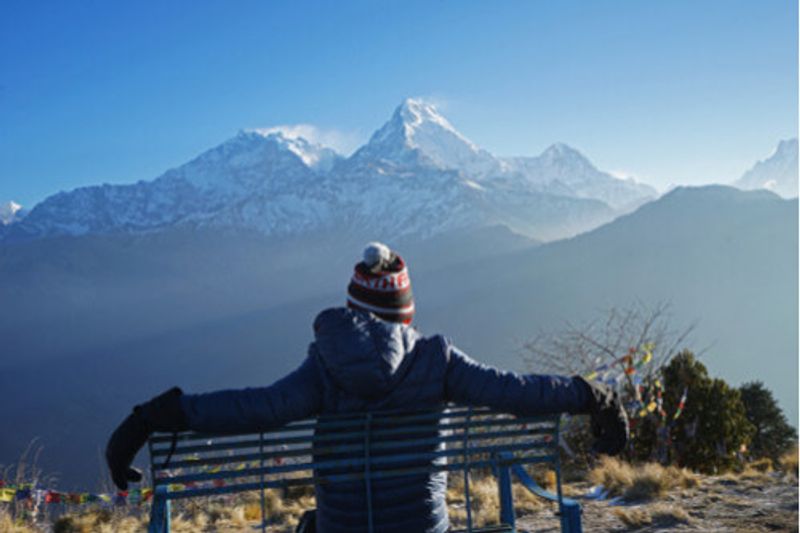 A tourist rests at Ghorepani Poon Hill, Nepal.