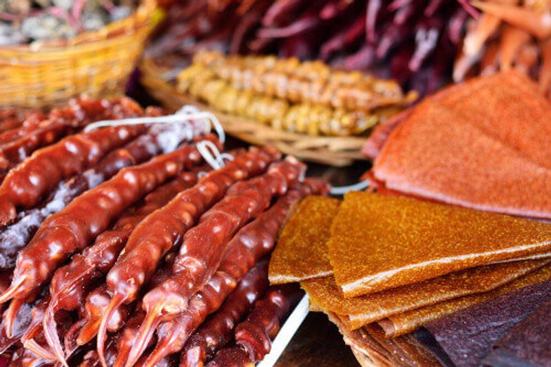 Churchkhela and Tklapi candy a traditional Georgian sweet treat on a bazaar in Tbilisi.