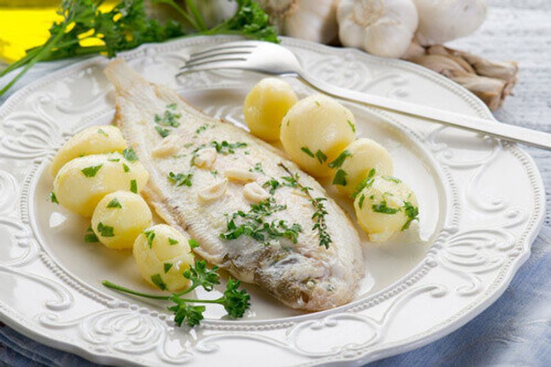Sole Meuniere a French dish that features potatoes and fish