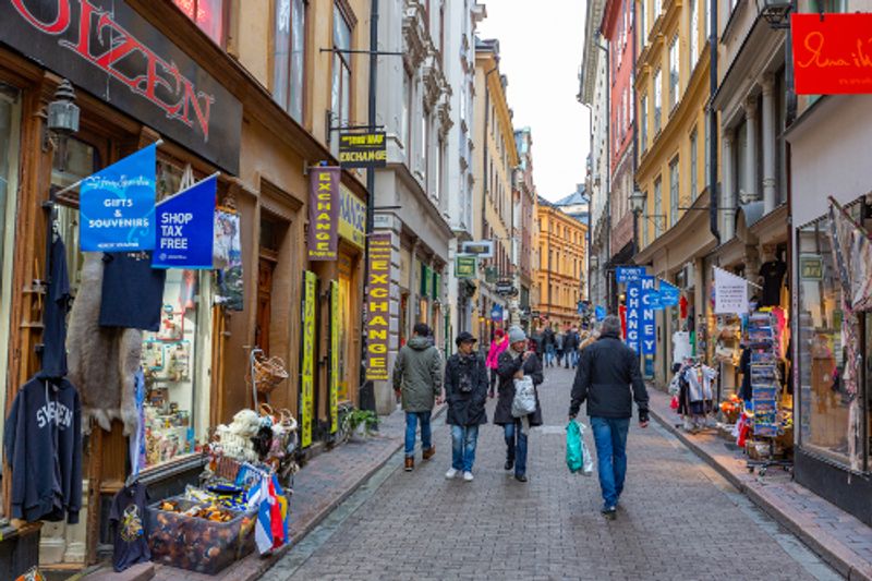People shop in Gamla Stan or Old Town in Stockholm.