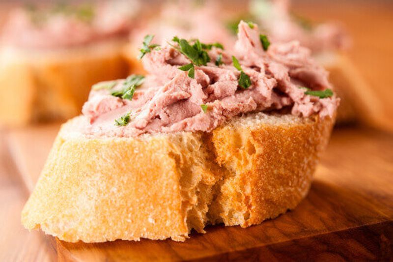 German Liverwurst on sliced baguette with parsley