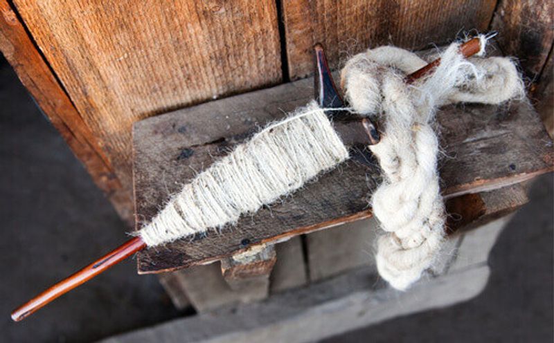 Primitive Nepalese spindle for spinning of yak wool in Nepal.