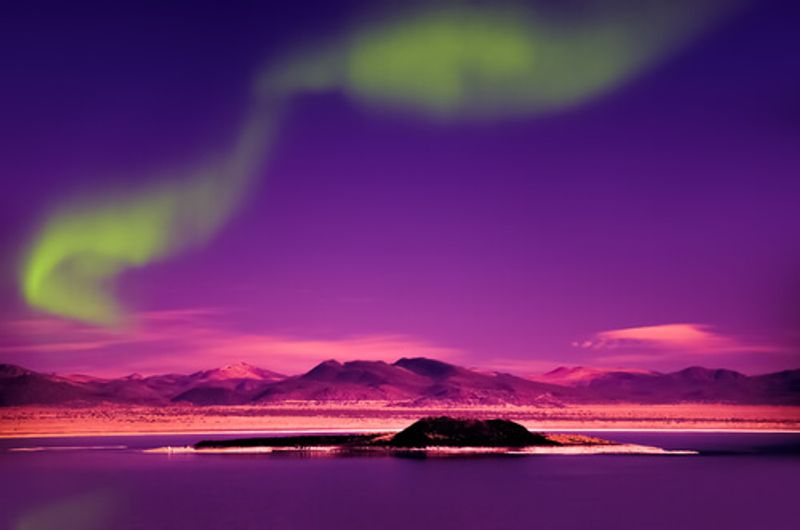 The Northern Lights illuminate the night sky, dazzling visitors.