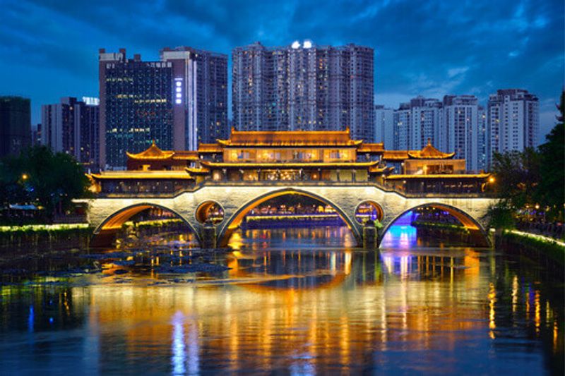 Anshun bridge over Jin River, illuminated at night in Chengdu, Sichuan.