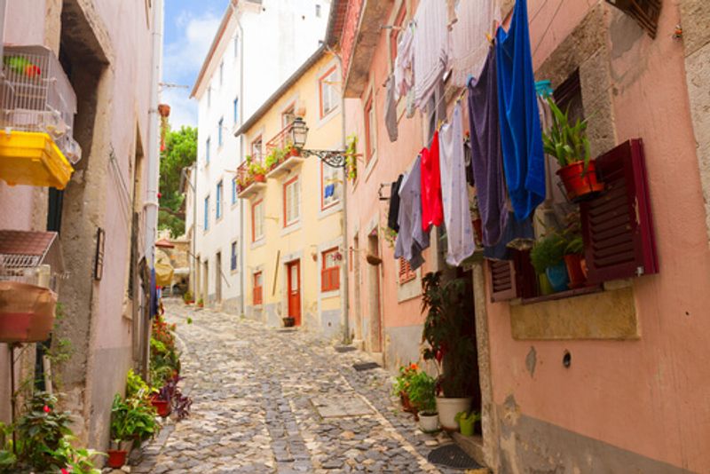 Washing hangs in a homely street of Baixa, Lisbon.