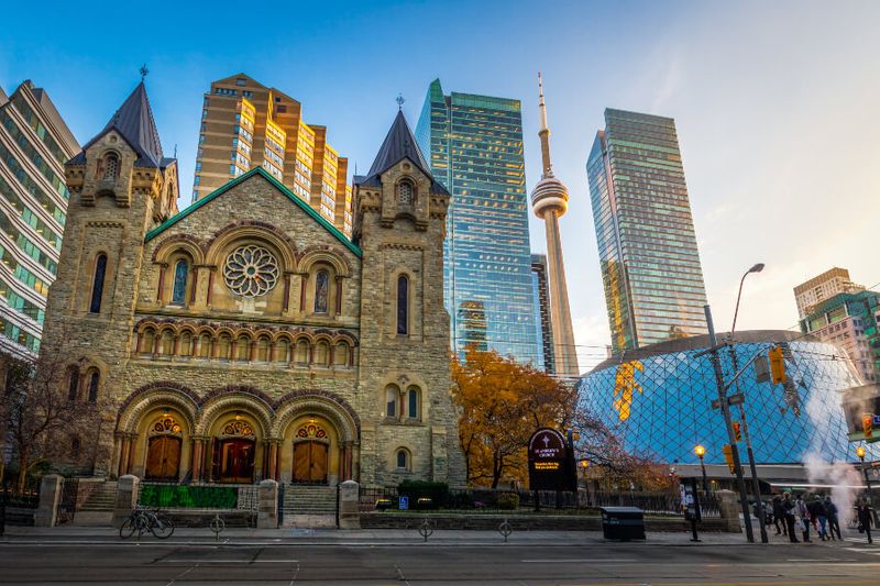 Panoramic view of the St. Andrews Presbyterian Church and the CN Tower.