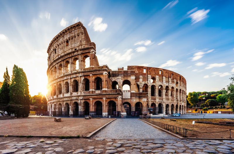Begin your Italy travel experience at sunrise with a quiet moment at Rome’s iconic Colosseum