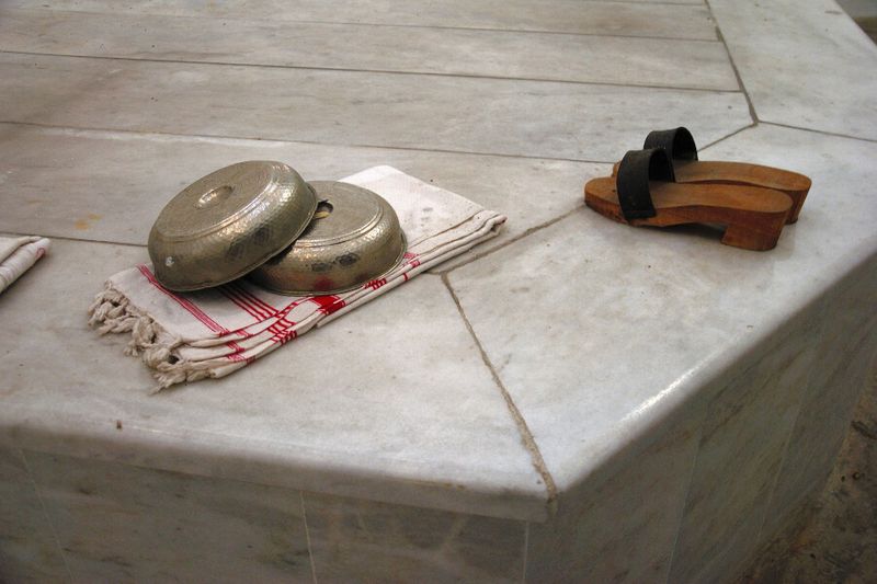Silver bath bowls, peshtemal towels and wooden clogs at the Turkish Bath
