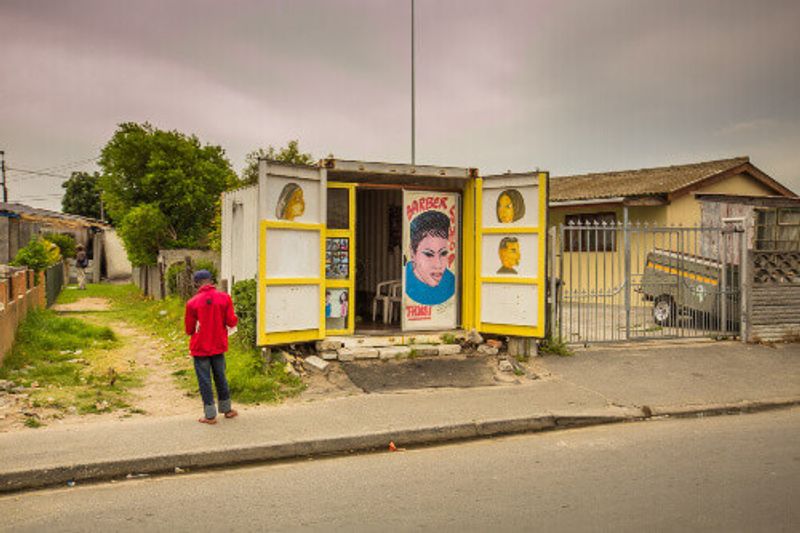 Shipping containers turned into homes with African graffiti on its doors in the township of Langa.