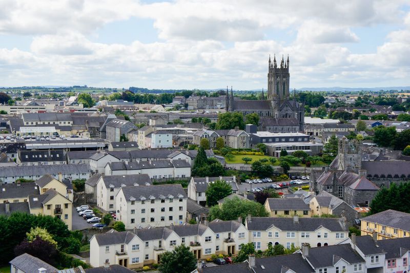 The view of the medieval city of Kilkenny with its grey limestone buildings under a cloudy sky
