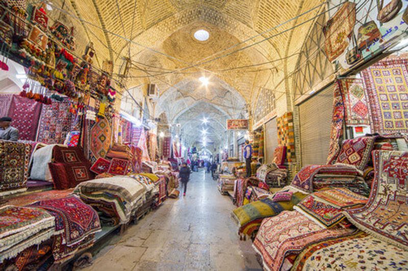 Traditional Iranian carpets in a shop in Vakil Bazaar Shiraz, Iran.