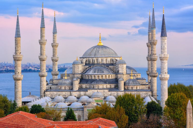 Minarets and dome designs of the Blue Mosque with the Marmara Sea and Bosporus Strait in view.