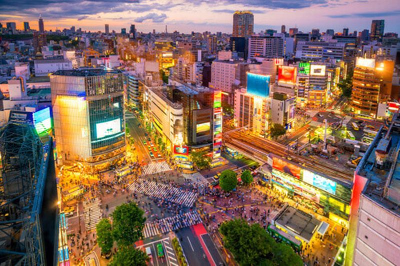 Shibuya Crossing from a top view at twilight in Shibuya, Tokyo.