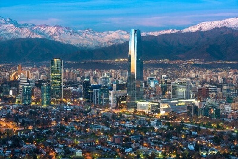 Panoramic view of the Providencia and Las Condes districts with Titanium Tower and Los Andes Mountain Range in sight.
