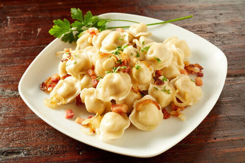 Stuffed Pelmini Pasta Dumplings, a traditional Russian dish filled with spicy meat, is enjoyed by many in Russia.