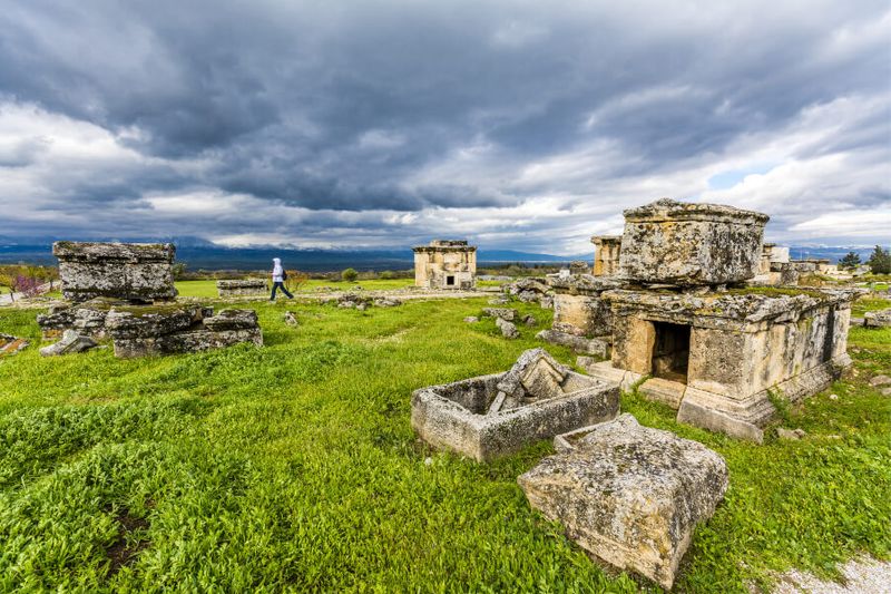 Tourist walking at the necropolis or cemetery of Hierapolis.