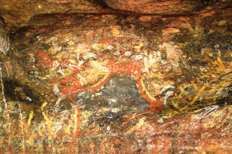 Rock painting at Uluru, a large sandstone rock formation and Australian landmark.