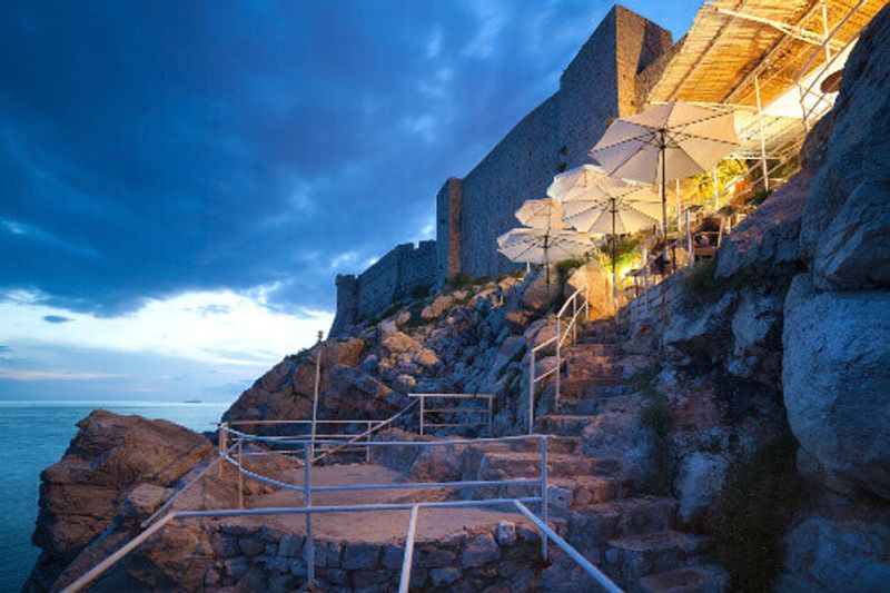 Buza Beach Cafe is one of the most beautiful bars in Dubrovnik which hangs on the cliffs overlooking the Adriatic Sea.