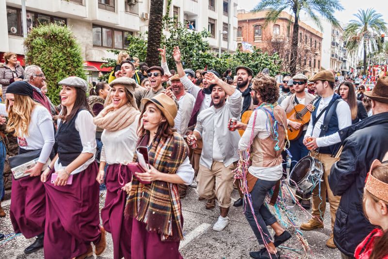 Carnival participants celebrating during the parade in the streets of Algeciras in Cadiz, Spain.