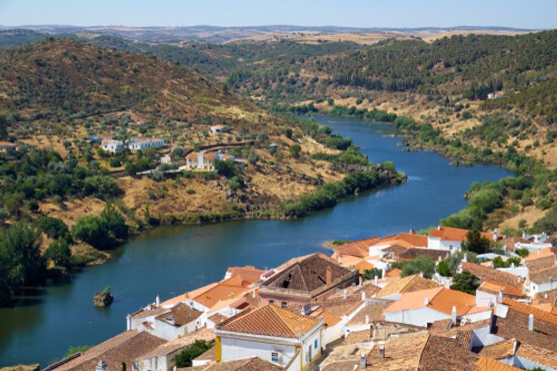 An aerial view of the riverside town of Mertola.