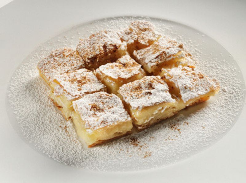 The delicious Bougatsa, cut into squares.