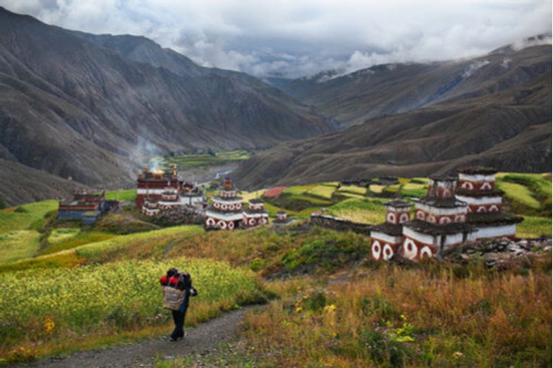 A local walks down the path to Saldang Village, Upper Dolpo.