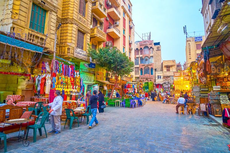 Wide streets with traditional Egyptian restaurants in Khan El Khalili Souq.