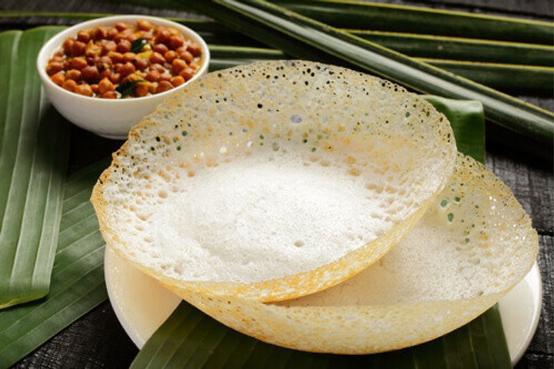 If in South India, homemade appam with chickpea curry is a must-have.