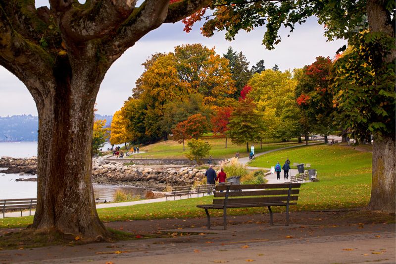 Visitors and locals alike enjoy an autumn day in Stanley Park, Vancouver.