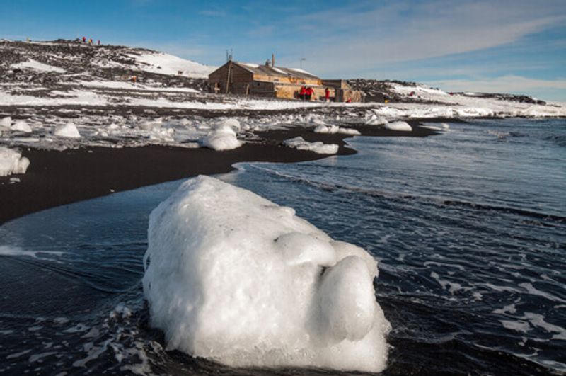 : Scott's Hut is visible against the backdrop of cold Antarctica.