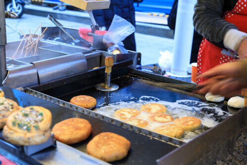 Korean street food, seed hotteok at BIFF Square in Busan.