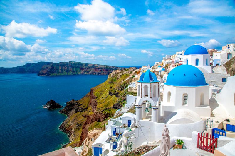The coastal town of Oia famous its houses painted white and blue