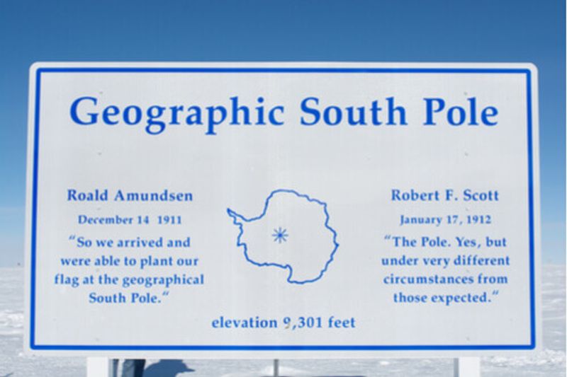 A sign shows the geographic South Pole in Antarctica.