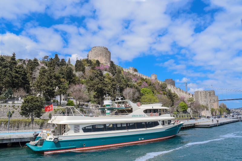 Rumeli Fortress on the Bosphorus Strait with a cruise ship in the background.