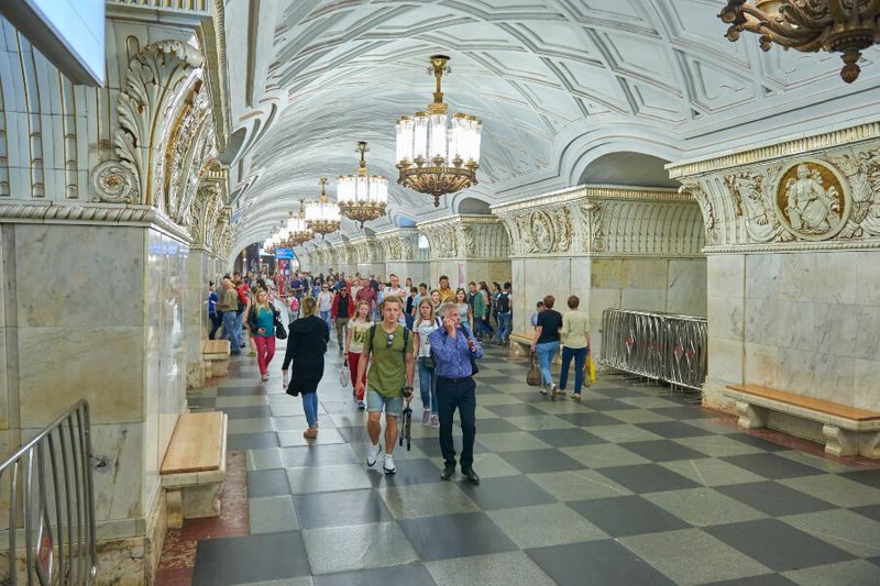 People inside the intricately designed Moscow Metro