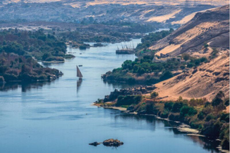 A view of the sunset over the Nile River near Aswan City, Egypt.