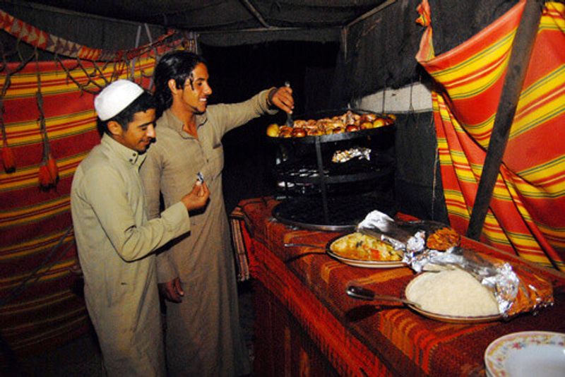 Bedouins cooking zarb in Wadi Rum, Jordan.