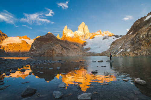 Traveller enjoys a sunrise at Laguna de los Tres (Los Glaciares National Park) in Patagonia Argentina