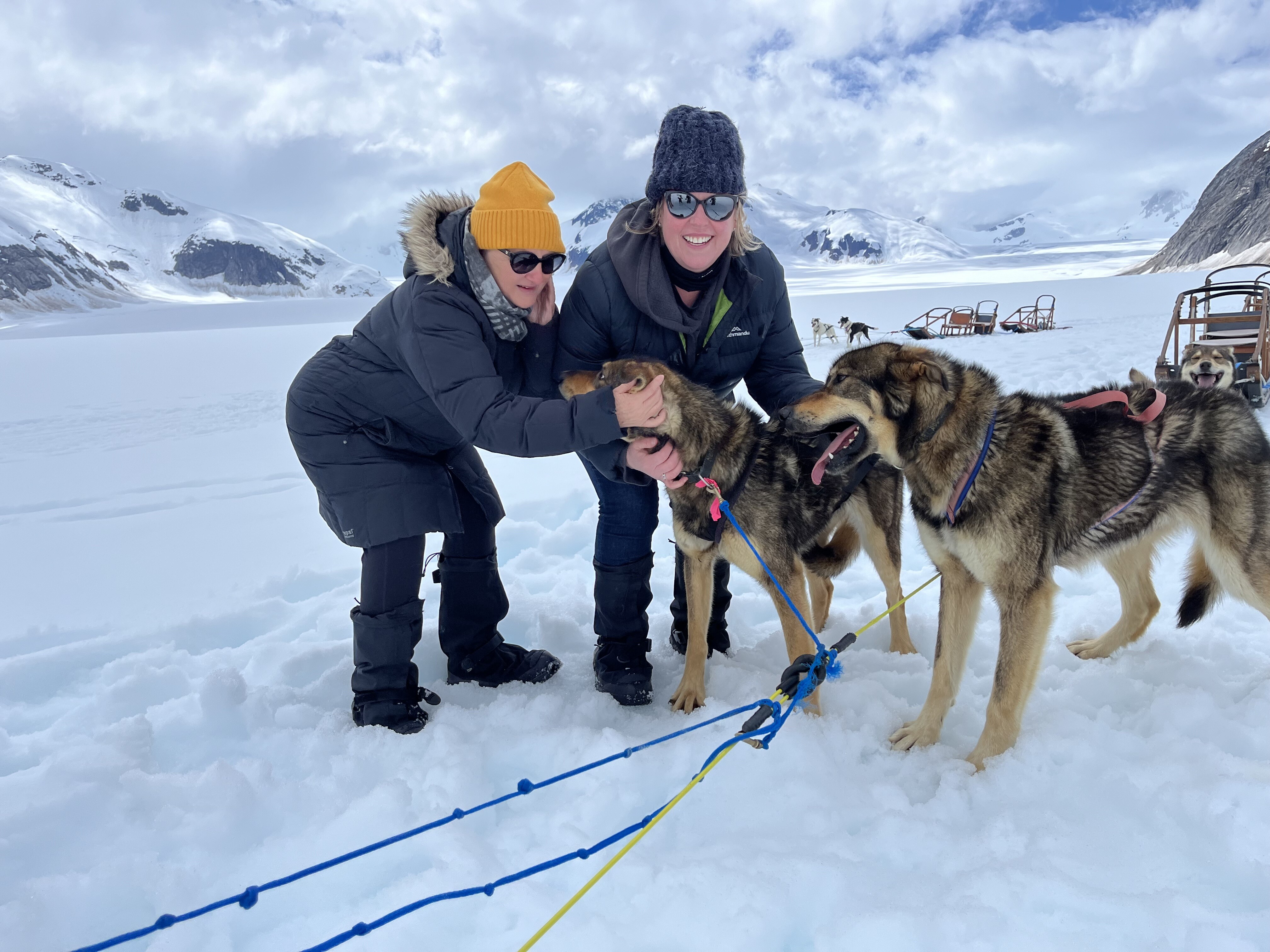 Inspiring Vacations customer dog sledding through snowy Finland, a thrilling highlight of our Finland winter tours