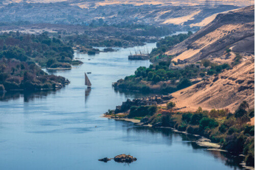 A view of the sunset over the Nile River near Aswan City, Egypt.